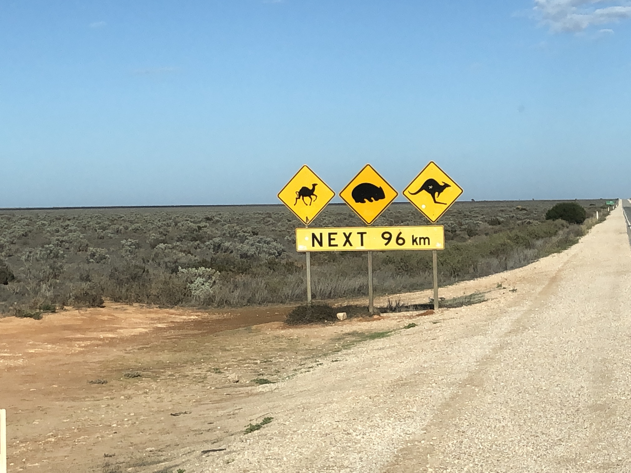 2020-03-27  Nullarbor signpost - long stretches of dead straight, flat road!